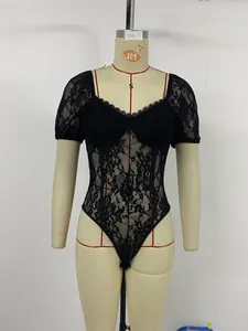 Detail of black floral lace bodysuit with sweetheart neckline and puff sleeves