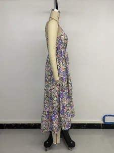 Side view of floral spaghetti strap dress with tiered ruffle hem on a mannequin