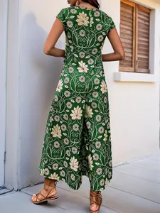 Detail of green floral print jumpsuits with sleeveless design and linen texture
