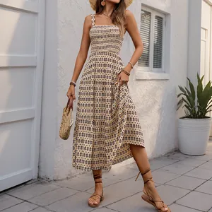 Bohemian tiered maxi dress with geometric print and smocked bodice for summer vacations