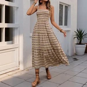 Bohemian smocked bodice maxi dress with tiered A-line skirt and geometric pattern