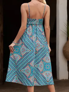 Detail of smocked back and ethnic paisley print on a blue summer slip dress