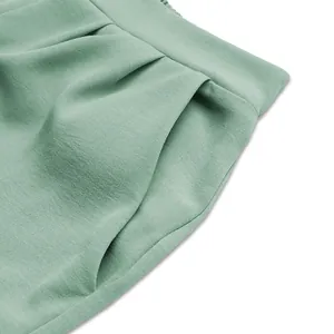Detailed macro view of mint green casual two-piece set showing side pocket and twill fabric