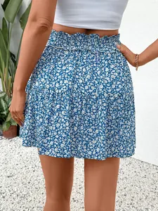 Women's summer floral tiered mini skirt with high-waisted smocked waistband in blue