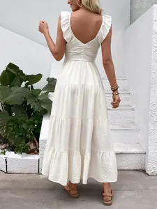 Elegant white sleeveless V-neck backless tiered maxi dress with ruffled shoulders