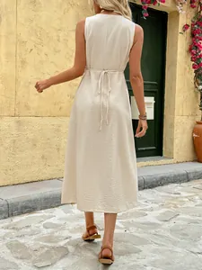 Sleeveless minimalist beige midi dress with round neck and waist tie for summer fashion
