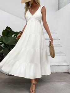Elegant white summer maxi dress with V-neck and layered tiered skirt for beach vacation