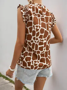 Detail of giraffe print sleeveless blouse with ruffle shoulder trim and back button closure