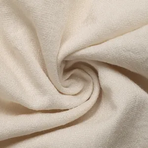 Macro detail of breathable cream cotton-linen fabric with natural fiber texture