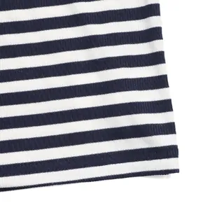 Detailed close-up of blue and white striped ribbed fabric with neat double-needle stitching