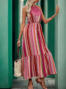 Detail of pink lace crochet neckline and halter design on a striped summer dress