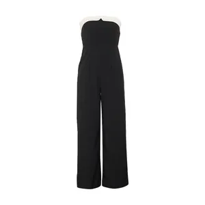 Detail of strapless jumpsuit with white trim contrast and a subtle V-neckline cut