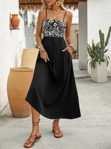 Detail of bohemian summer dress showing functional side pockets and printed bodice texture