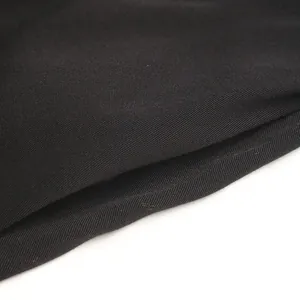 Detailed macro view of black twill weave fabric texture for summer sleeveless dresses