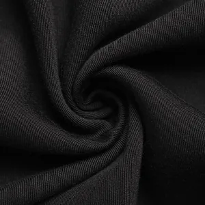 Macro detail of high-quality black knitted fabric texture with soft elastic folds
