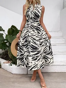 Detail of zebra print sleeveless maxi dress with tiered skirt and waist tie design