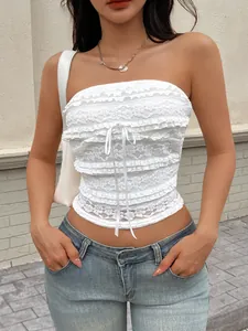 Haut court en dentelle blanche sans manches avec nœud et volants pour style d'été