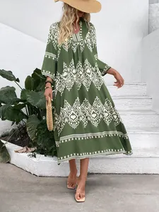 Detail of army green boho maxi dress with white geometric ethnic print and relaxed fit