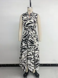 Detail of V-neck sleeveless maxi dress with zebra print and layered tiered skirt