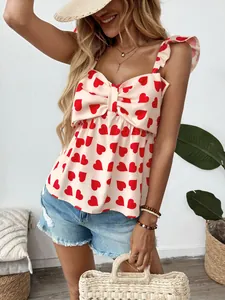 Pink heart print camisole top with large bow and ruffled straps for summer
