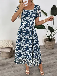 Detail of elegant square neckline and blue floral butterfly print on a summer midi dress