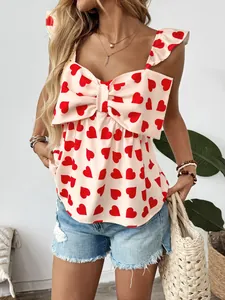 Detail of red heart print camisole with large bow knot and ruffle sleeves on mannequin