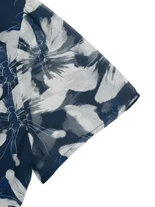Detailed macro shot of the square neck dress cuff with blue abstract floral print
