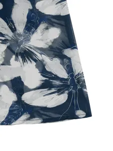 Close-up of lightweight chiffon fabric with elegant blue and white floral prints
