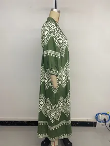Detail view of ethnic geometric print on a green long sleeve vacation maxi dress