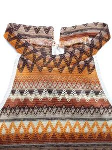 Detail of bohemian knit halter top featuring colorful wave patterns and fine stitching