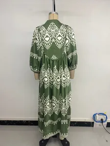 Detail of the back waist pleats on this dark green ethnic print maxi dress