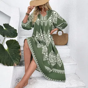 Green bohemian maxi dress with white geometric prints and lantern sleeves for beach vacation