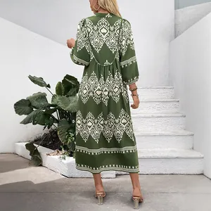 Bohemian green maxi dress with ethnic geometric prints and long puff sleeves back view