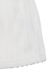 Close-up of white ribbed knit fabric detailing neat vertical textures and overlock hem stitching