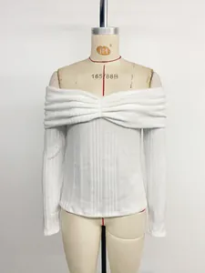 Close-up of white off-shoulder knit top with rib-knit texture and front twist knot