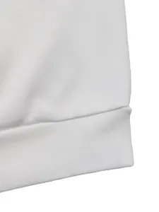 Detailed macro view of white sweatshirt ribbing and high-quality knitted cotton texture