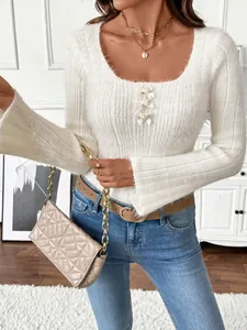 Slim fit white knit sweater with square neck, 3D floral accents and flared long sleeves