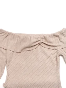 Detail of off-the-shoulder rib-knit top with ruffled neckline and pleated drawstring knot