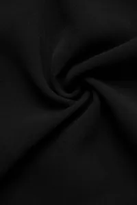 Detailed macro view of black lace-stitched fabric with smooth texture and drape