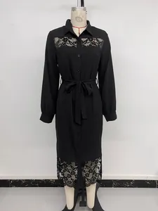 Detail of the black lace patchwork midi dress featuring a button-down shirt collar and belt