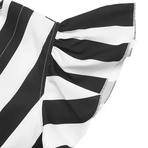 Macro detail of high-density stitching on striped ruffle sleeves of a V-neck blouse