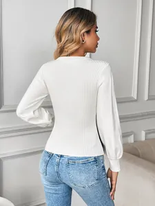 Chic white ribbed knit long-sleeve sweater with a slim fit and stylish crew neck