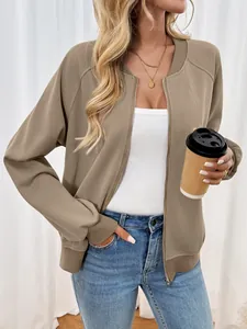 Detail of ribbed cuffs and collar on tan zip-up jacket for casual autumn wear