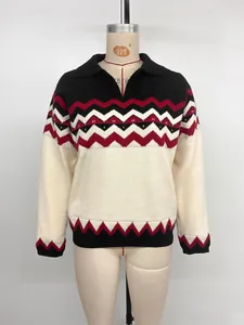 Detail of polo collar and red zigzag knit pattern on long sleeve striped sweater