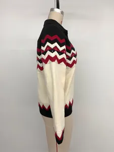 Detail of the knit texture with wavy jacquard pattern on this Christmas polo sweater