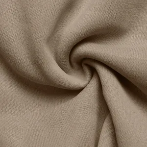 Close-up of khaki knit fabric texture with soft drapery and premium finish for women's jacket