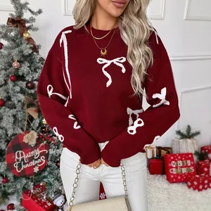 Women's burgundy Christmas sweater with white bow patterns and classic crew neck