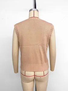 Detail view of the pink knit vest back showing rib-knit hem on a mannequin