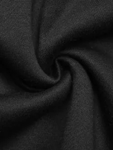 Close-up of black fleece-lined knit fabric texture showing softness and premium quality