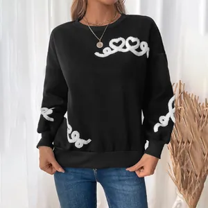 Women's black fleece sweatshirt with white textured heart embroidery and wavy cuffs